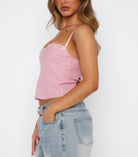 Women's solid back knot tank top in pink, perfect for casual summer outfits