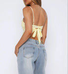Stylish solid back knot tank top in yellow, perfect for summer outfits with casual jeans