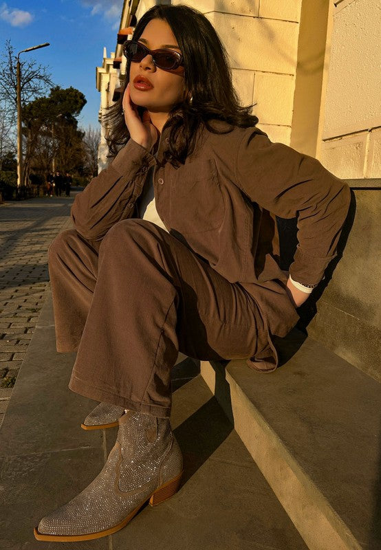 Rag Company sparkly cowboy boots for parties worn by a model on a city sidewalk