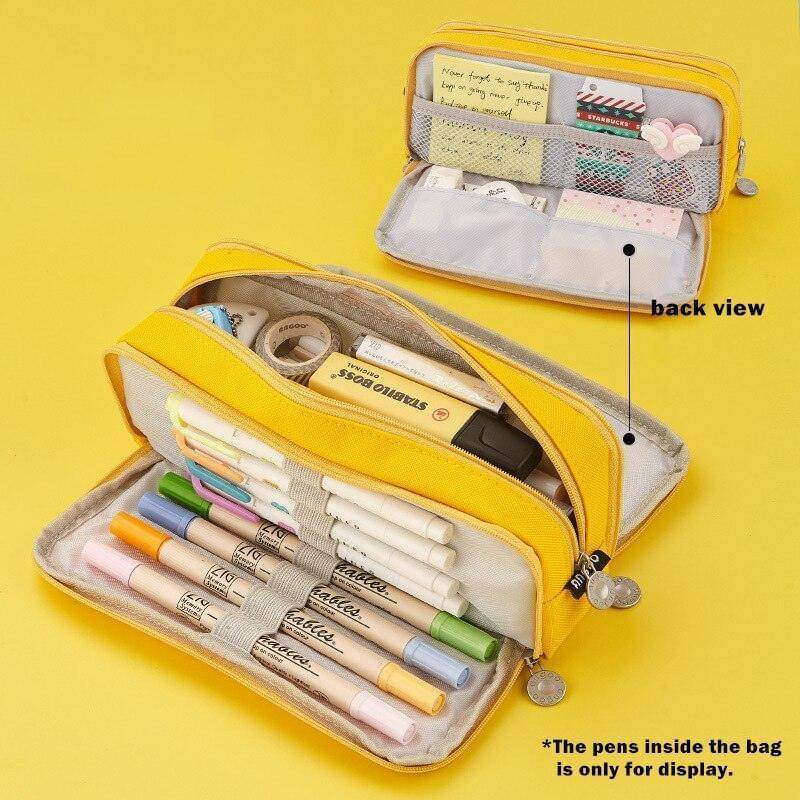 Dual side pencil case in yellow, showcasing two compartments filled with pens and stationery essentials