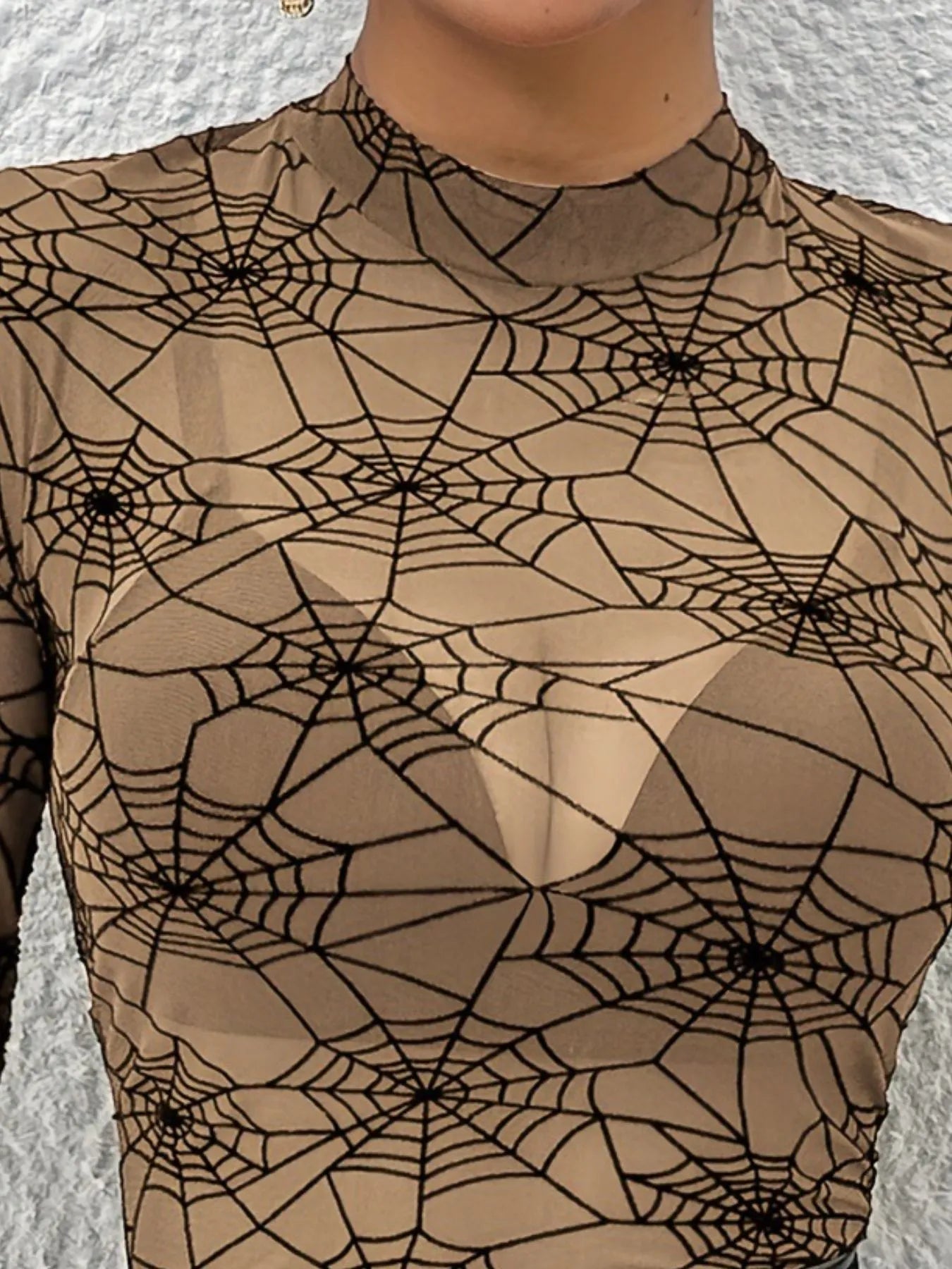 Trendsi women's spider web print blouse in a sheer design for a stylish and trendy look