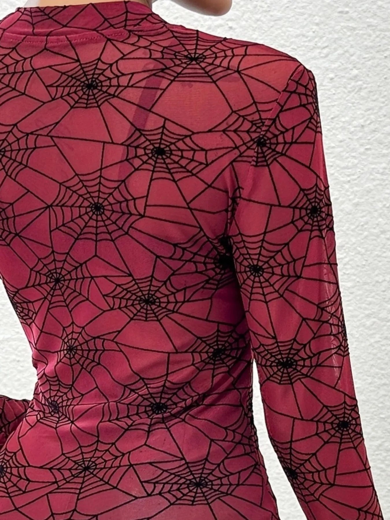Trendsi women's spider web print blouse in red featuring long sleeves and a stylish design