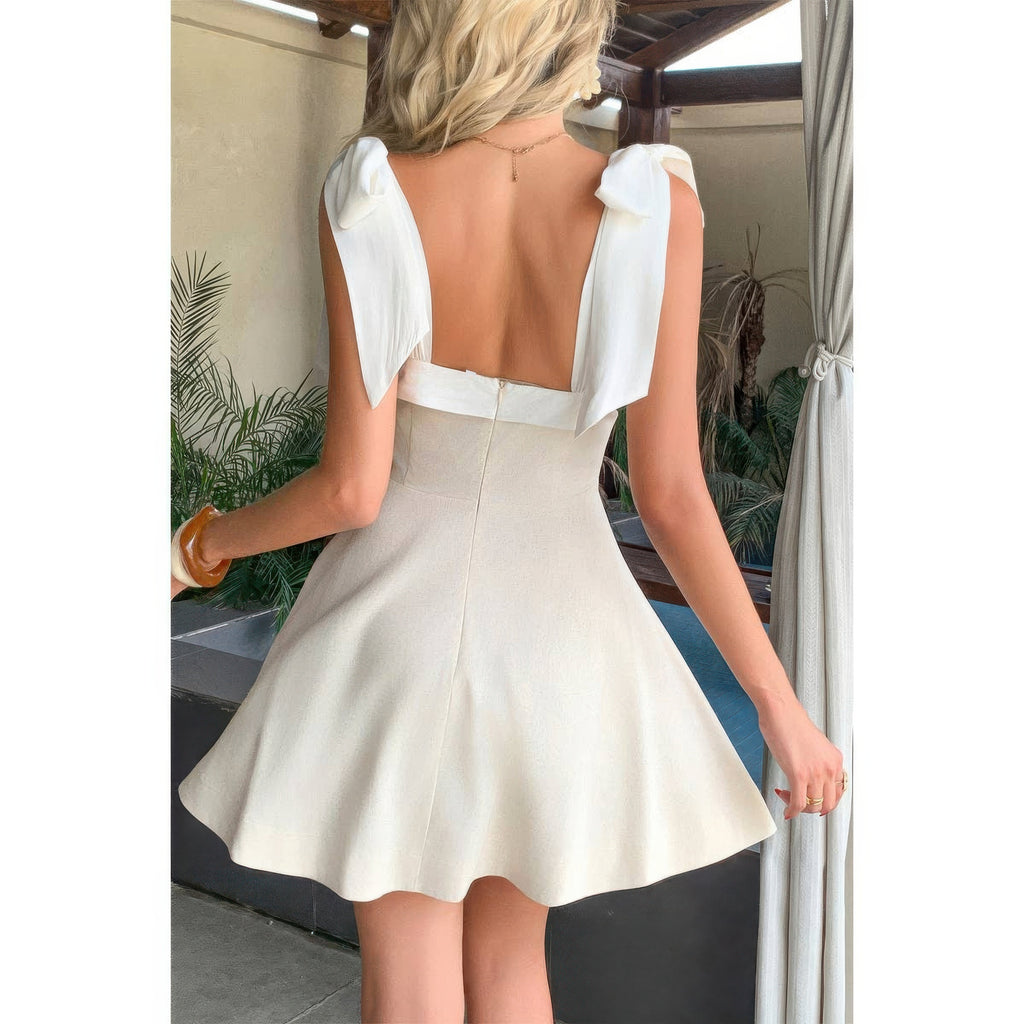 Women's square neck dress with bow sleeves, perfect for summer outings