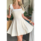 Women's square neck dress in cream, perfect for summer outings
