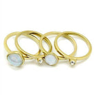 Set of stackable gold rings for women featuring a gemstone and a sparkling stone for a stylish look