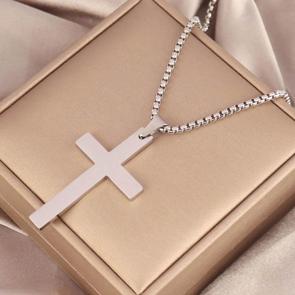 Men's stainless steel cross necklace on a stylish display box for a modern look