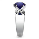 Stylish statement cocktail ring for women featuring a large blue gemstone in a sleek silver setting