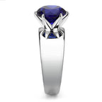 Stylish statement cocktail ring for women featuring a large blue gemstone in a sleek silver setting