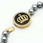 Elegant statement gold crown necklace with black pendant and stunning pearl accents