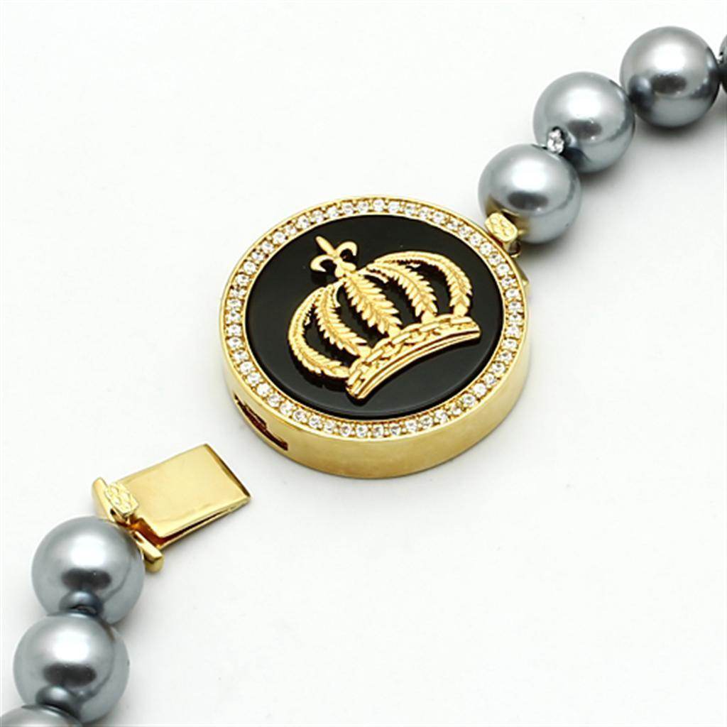 Elegant statement gold crown necklace with black pendant and stunning pearl accents