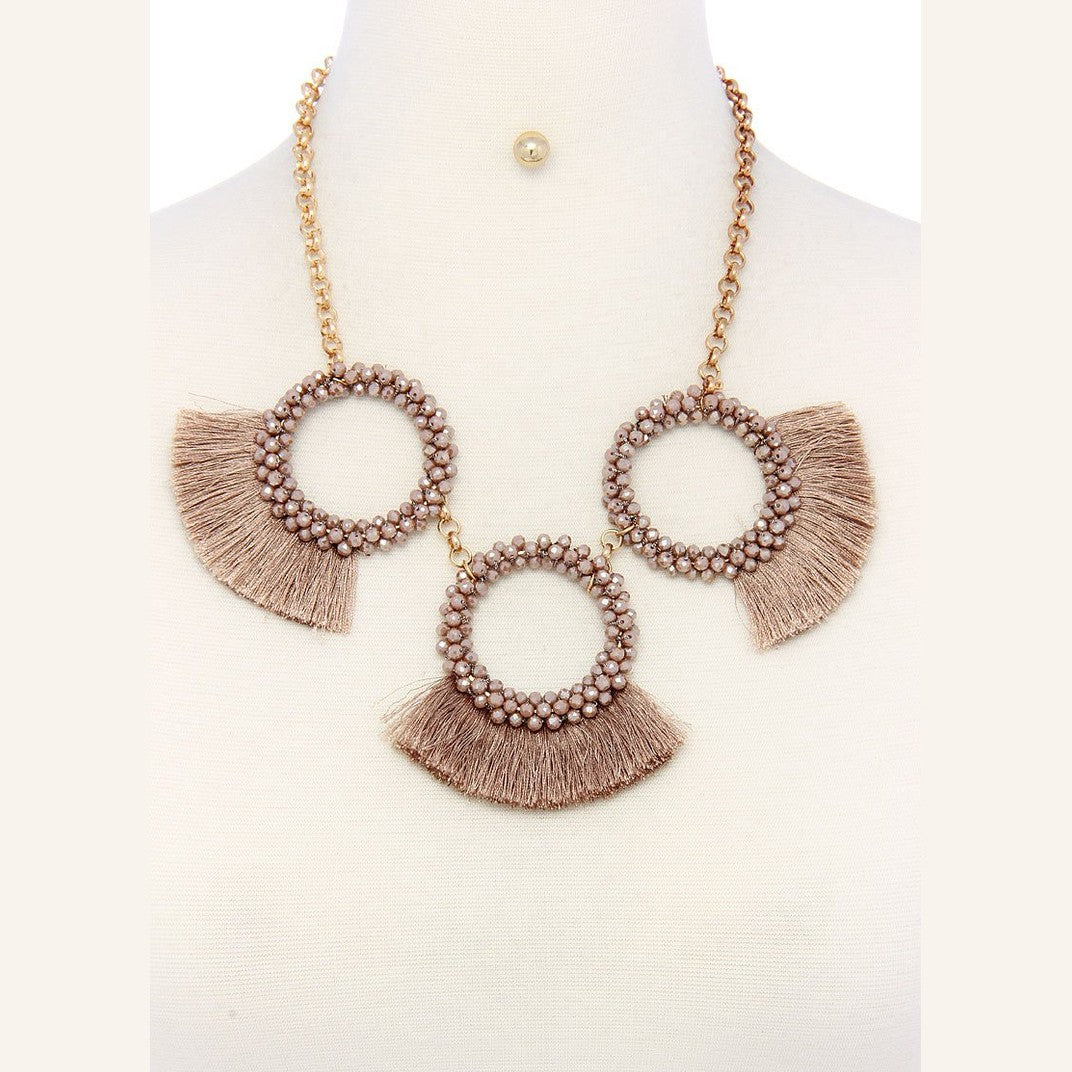 Stylish statement necklace and earring set for women featuring circular fringe design in neutral tones