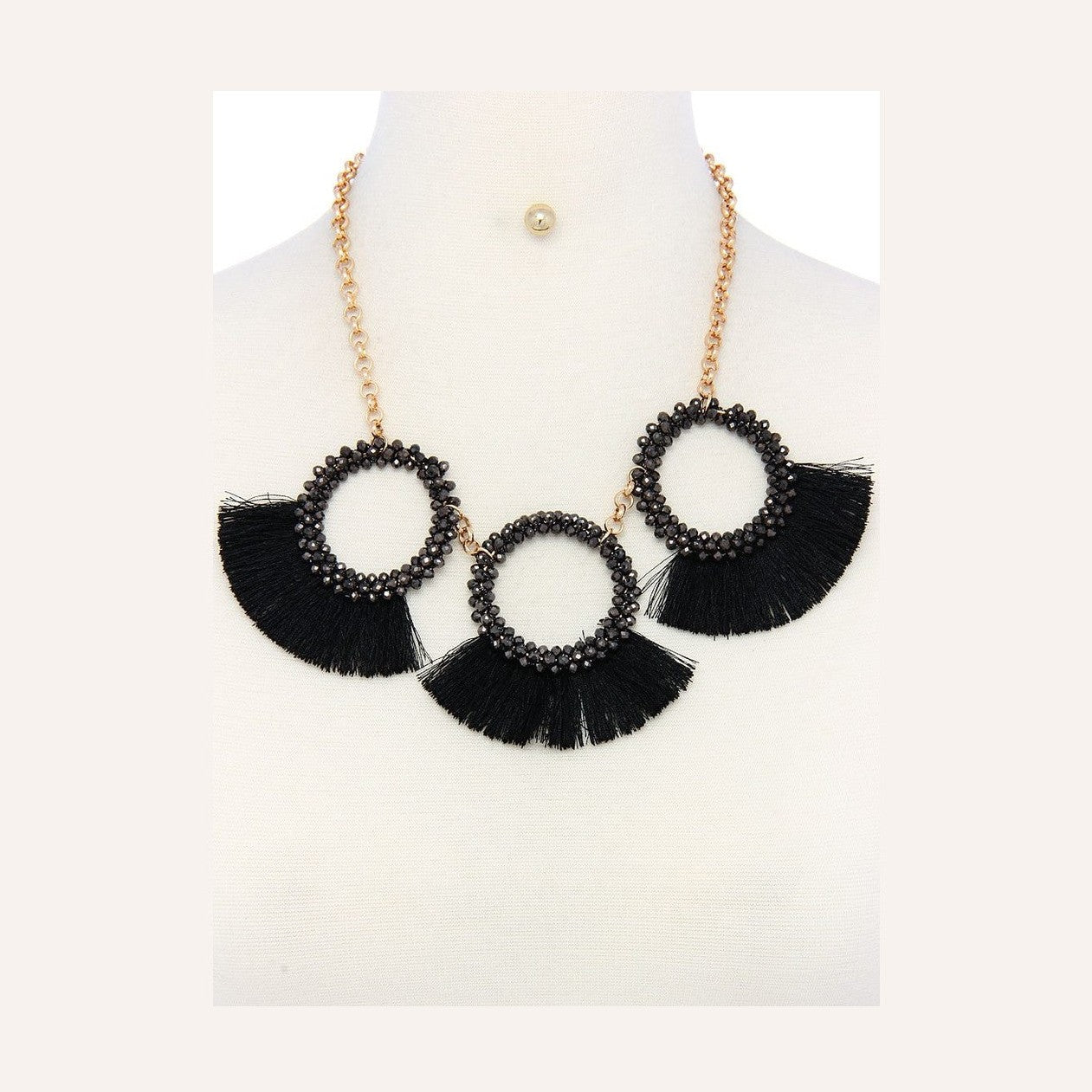 Stylish statement necklace and earring set for women featuring black tassels and beaded accents