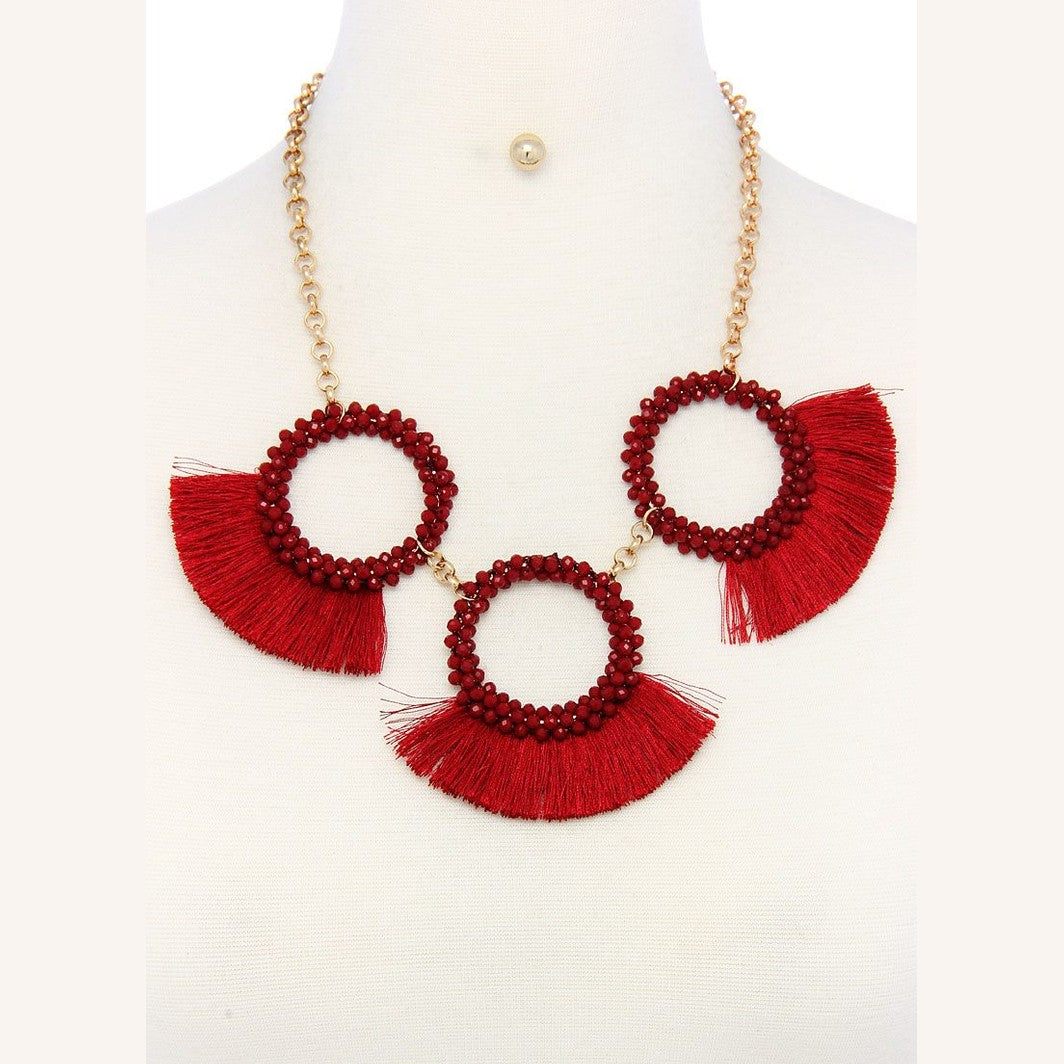 Bold red statement necklace and earring set for women featuring fringe and beaded circles
