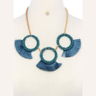 Teal statement necklace and earring set for women featuring bold tassel accents and beaded circles
