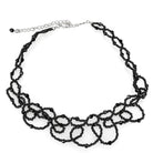 Elegant statement necklace rhodium brass with intricate black bead design for stylish outfits