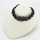 Elegant statement necklace rhodium brass in black lace design, perfect for any occasion