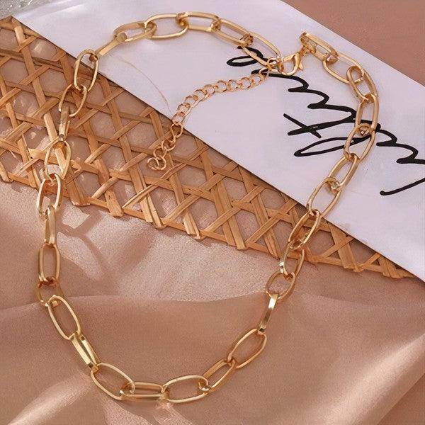 ClaudiaG Collection statement silver link necklace elegantly displayed on a textured background