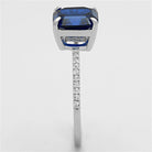 Luxury sterling silver engagement ring for women with a blue gemstone and sparkling accents