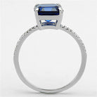 Elegant sterling silver engagement ring for women featuring a blue emerald-cut stone and sparkling accents