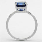 Elegant sterling silver engagement ring for women featuring a blue emerald-cut stone and sparkling accents
