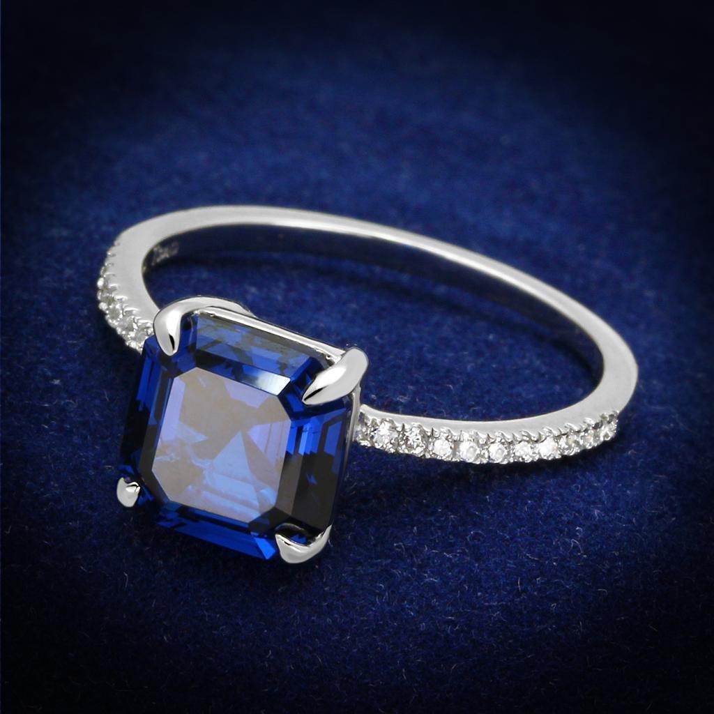 Sterling silver engagement ring for women featuring a blue gemstone and shimmering accents