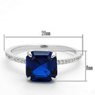 Sterling silver engagement ring for women featuring a large blue gemstone and sparkling accents