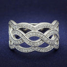 Sterling silver statement ring for women with intertwined design and sparkling accents