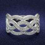 Sterling silver statement ring for women with intertwined design and sparkling accents