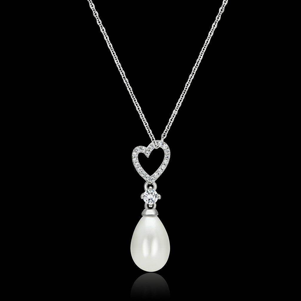 Elegant sterling silver vacation jewelry necklace featuring a heart-shaped pendant and pearl drop
