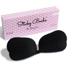 Sticky Boobs C Cup reusable adhesive bra for women packaged in a pink polka dot box