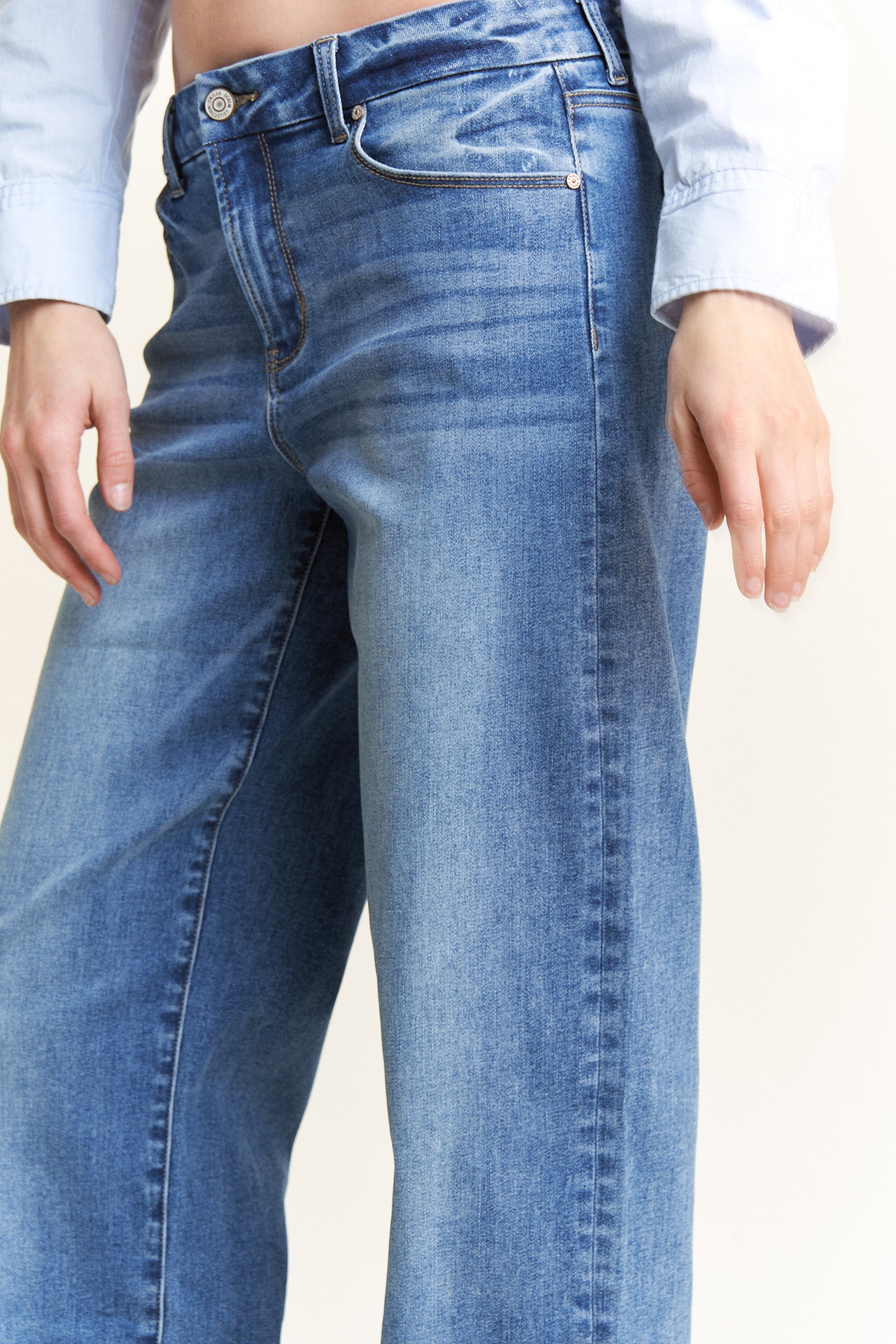 Women's straight leg blue jeans in light wash denim for casual wear