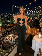 Black strapless cut-out jumpsuit for women, perfect for nightlife