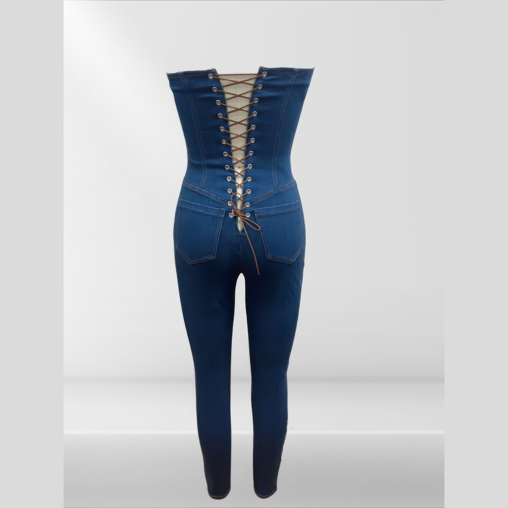 Back view of strapless denim jumpsuit with lace-up design and fitted silhouette from VacationGrabs