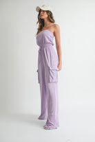 Stylish strapless romper jumpsuit in lavender with side pockets and a drawstring waist for a casual look