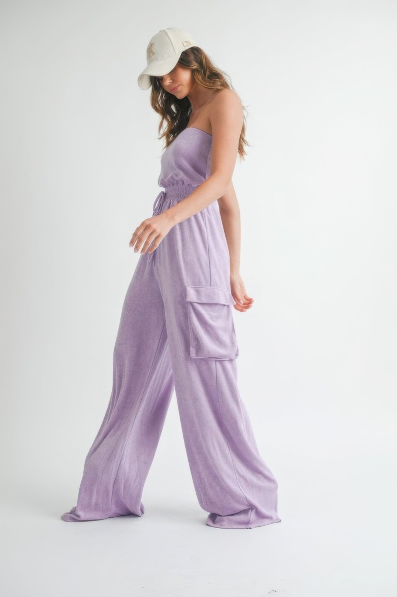 Light purple strapless romper jumpsuit with wide legs and side pockets for a stylish casual look