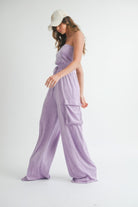 Light purple strapless romper jumpsuit with wide legs and side pockets for a stylish casual look
