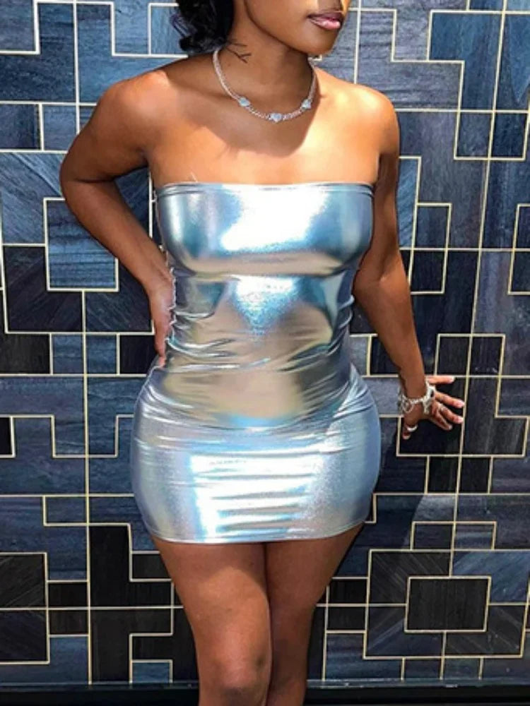 Woman wearing a strapless silver bodycon mini dress with a shiny metallic finish