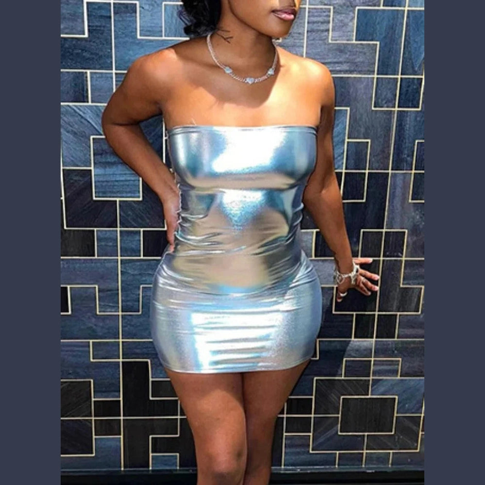 Woman wearing a strapless silver bodycon mini dress with a shiny metallic finish