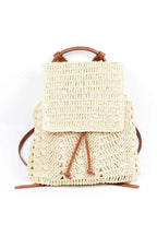 Natural straw beach backpack with a stylish woven design and leather straps for summer outings