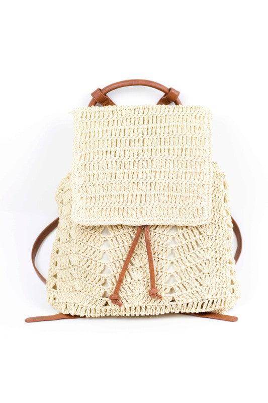 Natural straw beach backpack with a stylish woven design and leather straps for summer outings