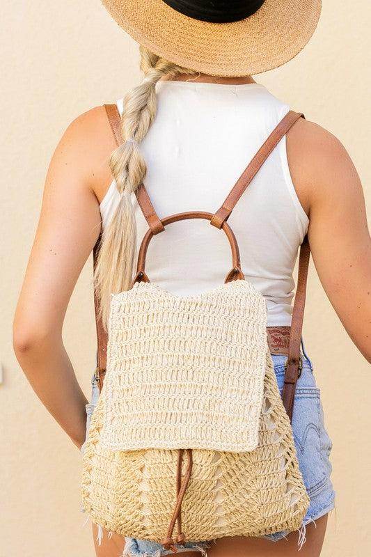 Aili's Corner straw beach backpack with a natural woven design and brown leather straps for stylish summer outings