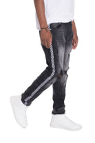 Men's black street style distressed pants with checkered side stripe and ripped details