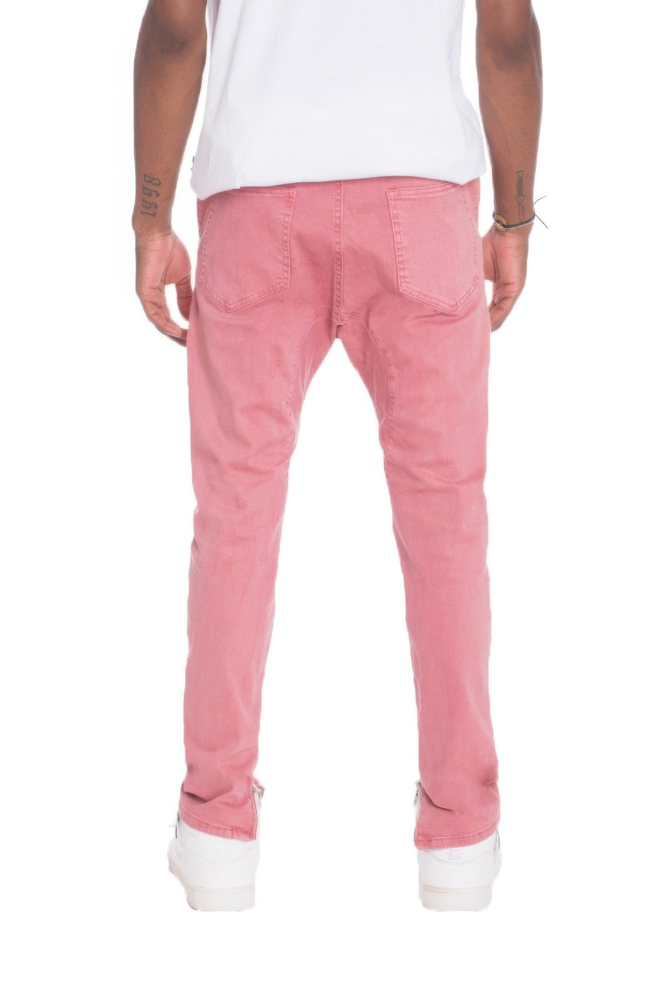 VacationGrabs men's pink jeans showcasing street style distressed pants from the back with a casual fit