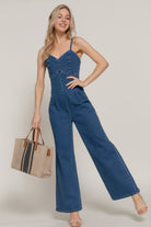 Stylish stretch cami jumpsuit for women in denim with wide-leg design and button detailing