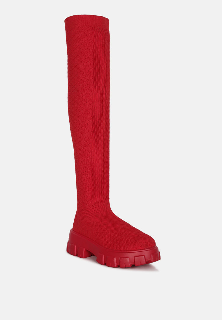Bold red stretch knit knee high boots with chunky sole for a trendy look