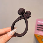 Stretch rubber hair ties for women in dark brown, perfect for styling hair