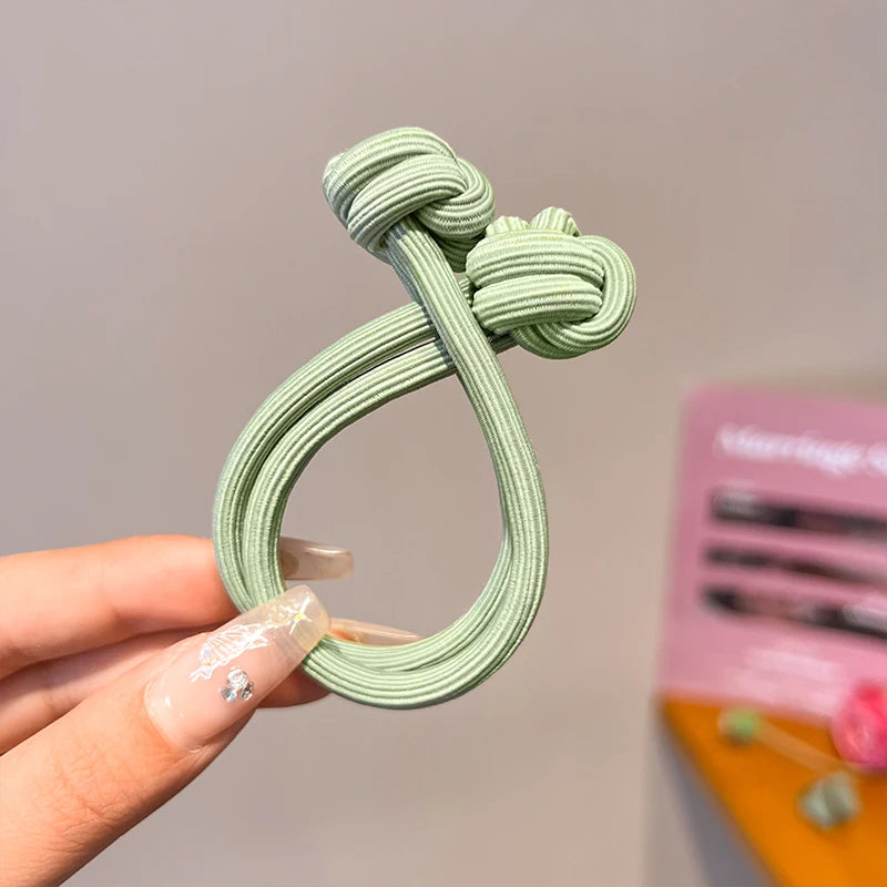 Green stretch rubber hair ties for women, perfect for easy styling
