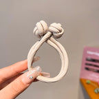 Beige stretch rubber hair ties for women, perfect for everyday hairstyles