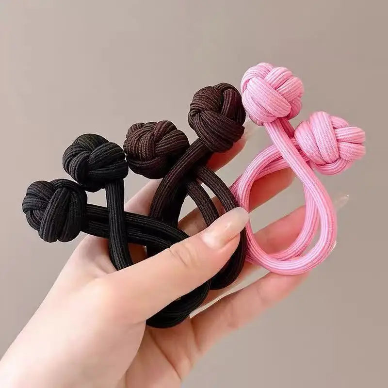 Stretch rubber hair ties for women, available in pink and black colors