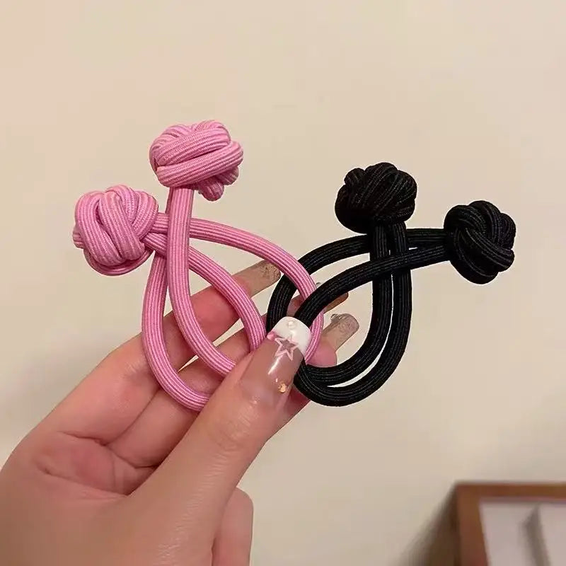 Stretch rubber hair ties for women in pink and black colors